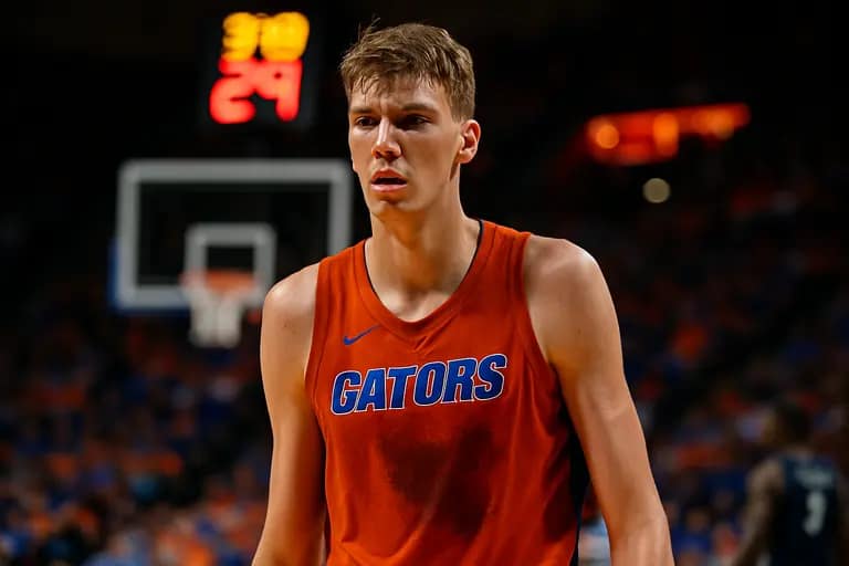 Florida bench watching late-game action during a college basketball matchup